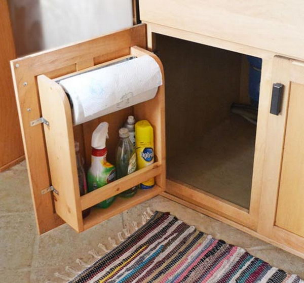 Attach brackets to the inside of the cabinet door to store toilet paper rolls, house cleaning supplies, tools, or any other bottom cabinet items.  