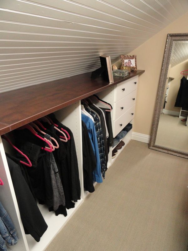 Attic Closet Storage With Shelf. If you are converting your attic into a living space, include some closet space in your design. Create your attic closet following the layout of the attic space.