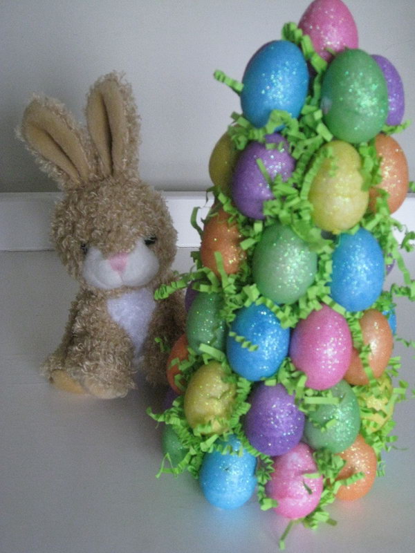 Easter Egg Tree. Stick colorful egg ornaments at a Dollar Tree. It's a fun craft to do with the kids and one that you can use every year. 