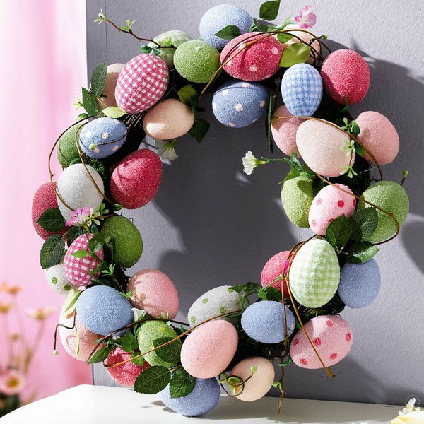 Use light color Easter Eggs with polka dots and leaves to decorate them into a Easter Egg Wreath.