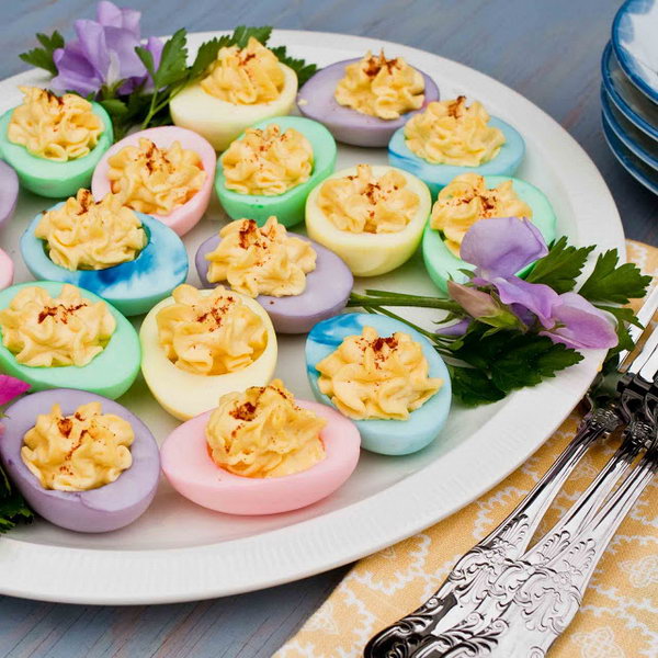 Delicious and Colorful Easter eggs. It's an easy way to twist your deviled egg recipe for Easter. These rainbow colored deviled eggs are an amazing healthy alternative to traditional deviled eggs. 