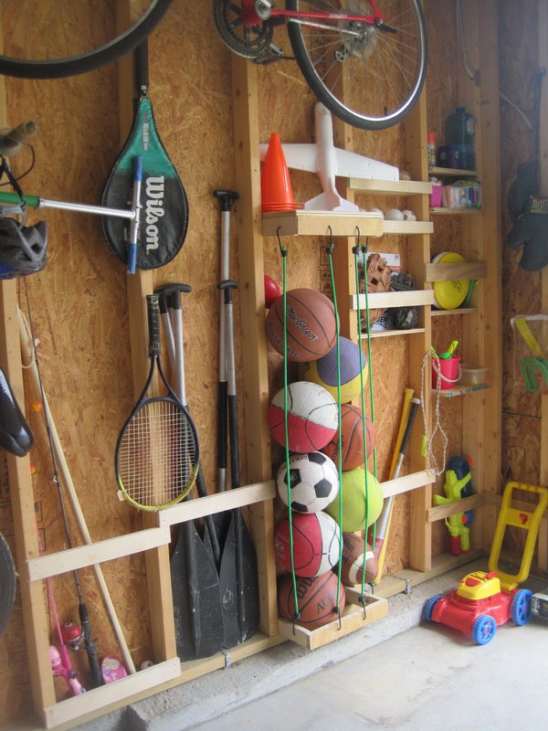 Storage Between the Studs. Utilize the space between the studs to keep things organized. A few bungee cords hung on studs gives you a great place to store all sorts of sports equipment. 