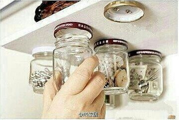 Hang Jars Under Shelves. Screw the jar lids into the wooden shelf that sits above the work top, and then screw the jar onto the mounted lid. Keep nails, screws and other small items out of the way and pretty organized. 