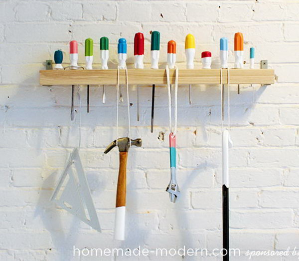 Screwdriver Coat Rack. Drill holes in a piece of wood and secure it to the wall with L-Brackets. 