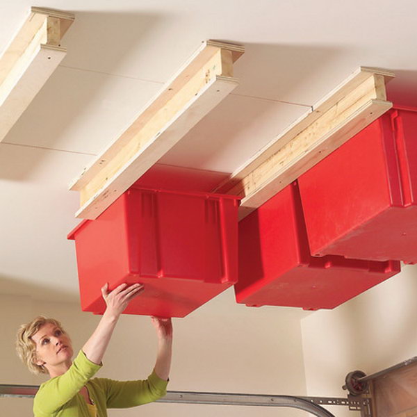 Sliding Storage on Garage Ceiling. Grab your plastic pins and build a simple system for hanging them in the garage. Get all that stuff up and out of the way and into unclaimed space near your garage ceiling. 