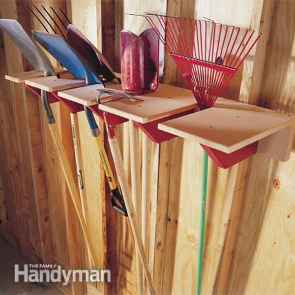 DIY Wooden Shovel Rack. A simple yet functional garage storage idea for yard tools. Keep them up and off the floor with this DIY rack. 