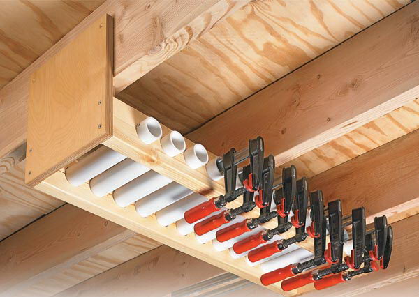 Garage Overhead Clamp Rack. Short lengths of PVC pipe held in the rack serve as compartments to store each clamp individually. By lining the pipes up side by side, have easy access to the exact size of clamp needed. 