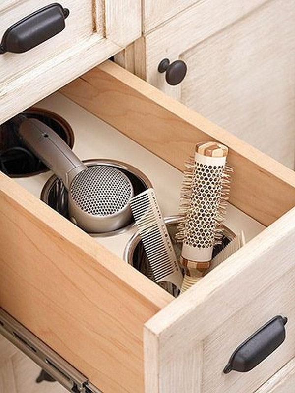 Bathroom Drawer Storage for with Compartments. Put a piece of wood and several bins in your bathroom drawer. Create extra space and keep your hair dryer organized.  