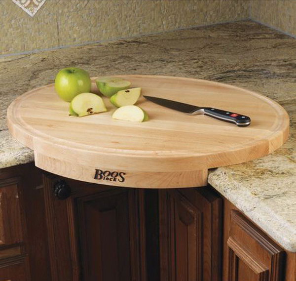 John Boos Corner Cutting Board. This oval-shaped maple wood cutting board converts a counter corner space into efficient working space. 
