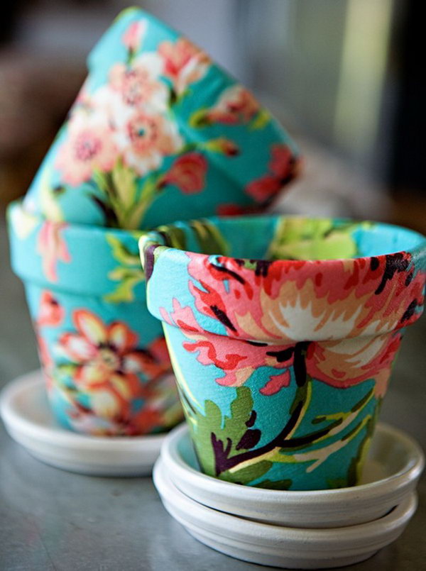Mod Podge on Terra Cotta with Fabric. Grab some pretty fabric and Mod Podge to cover a flower pot bought at a garden center. A cute last minute gift idea. 