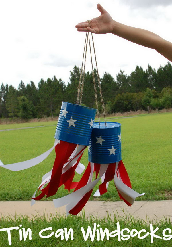 4th of July Tin Can Windsocks. What a cute idea to make these tin can crafts and decorate your yard for the 4th of July. 