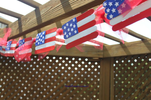 Popsicle Stick Flags. It is fun painting and gluing them to put this terrific banner together. You could even glue a paint stick to the bottom of the flag and use them as fans to cool you off on a hot Fourth of July. 