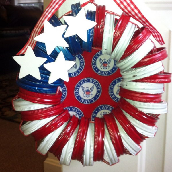 Patriotic Mason Jar Lid Wreath. Take leftover mason jar lids, paint them in red white and blue, wrap them in rope and create adorable wreath ornaments. Super easy and quick- perfect for kids and fun to embellish. 