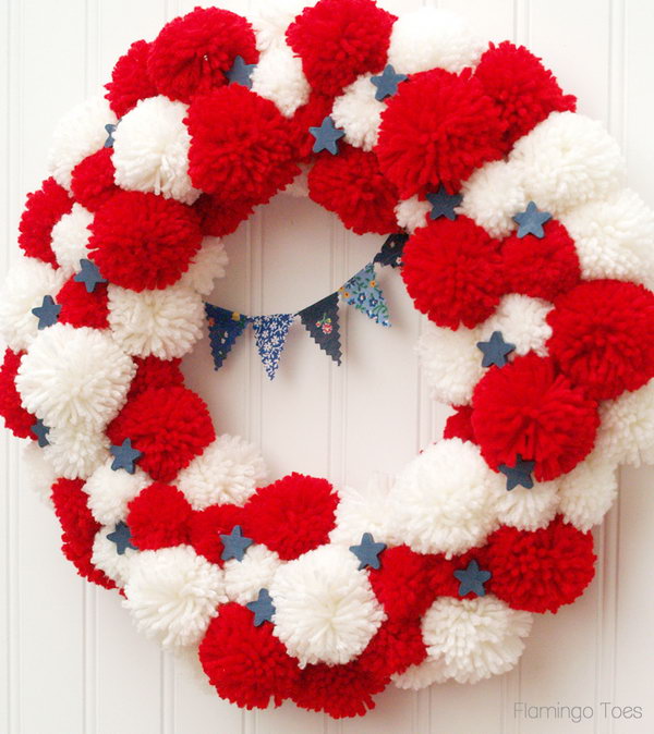 Patriotic Pom Pom Wreath for 4th of July or Memorial Day. The pom pommyness of this wreath is so cute. A great idea for all the summer holidays. 