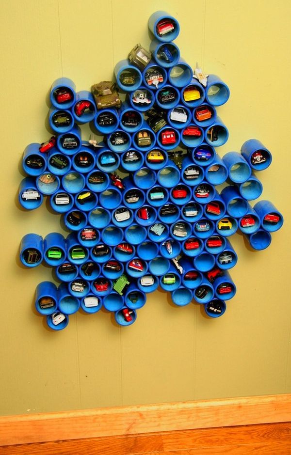 PVC Pipe Toy Storage. A creative way to store all those Hot Wheels cars. It make an artsy design on the wall that acts not only as storage but some stylish texture as well. 