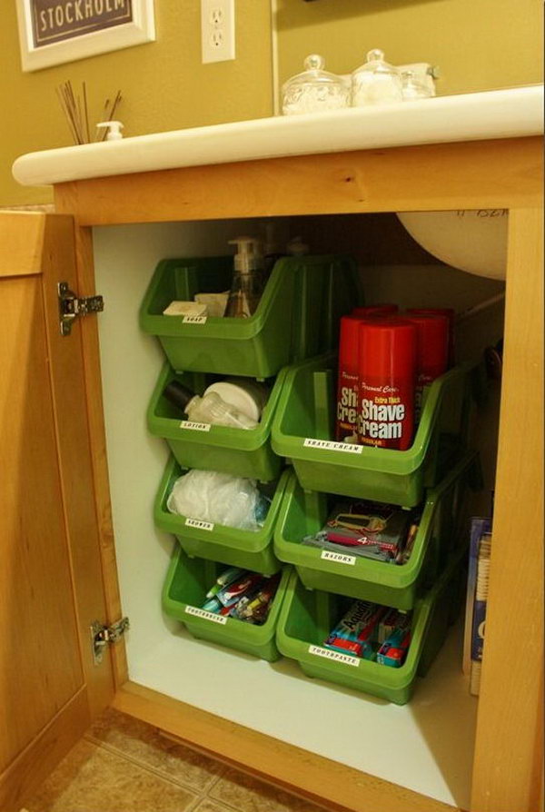 Stacking Plastic Bins Under Bathroom Cabinet. These stacking containers from the Dollar Tree stack vertically very well. You can even clearly see what is in the bins without labeling these organizers. 