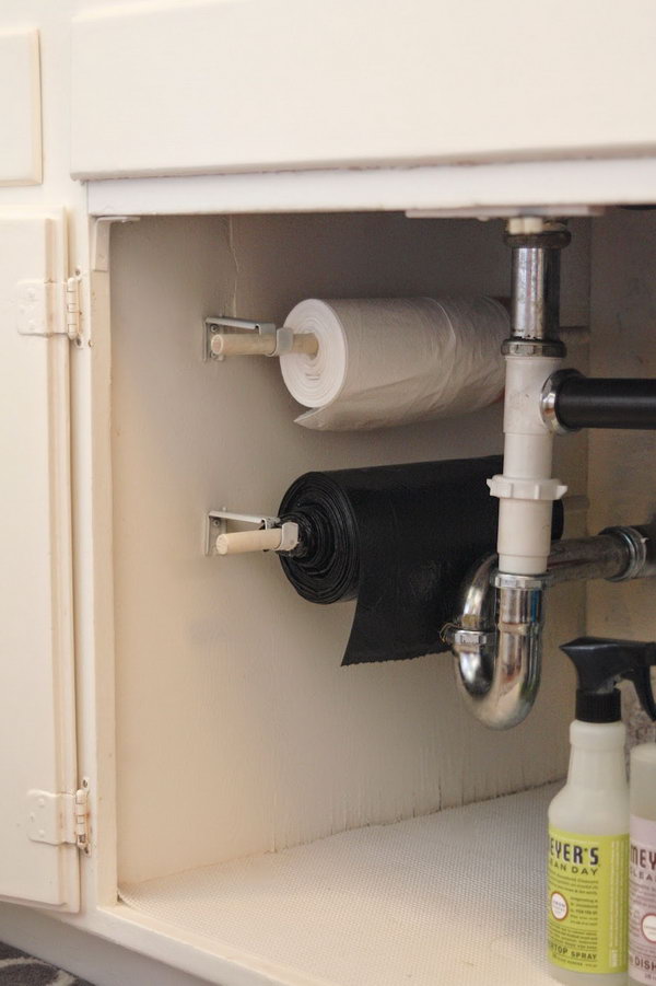 Use your under-the-sink space, and store your trash bags on a roll under the kitchen sink. 