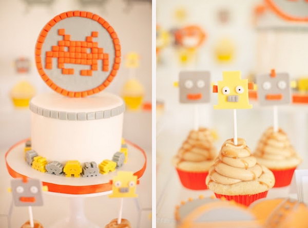 This cheery yellow, orange and grey space invaders themed birthday party was deeply impressive. Even the flower arrangements wear antennas! And they were so cute.