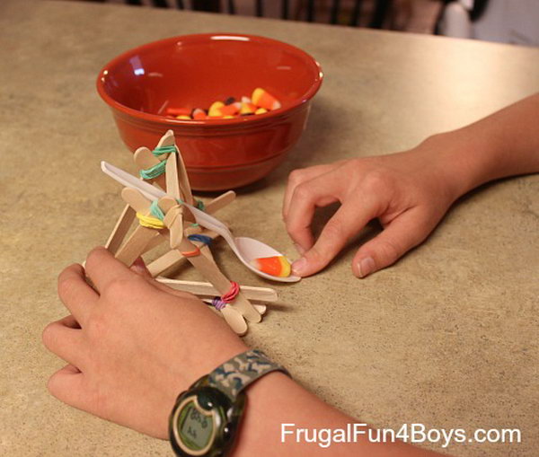 Popsicle Stick Catapult. This catapult is more different than the former two to built, but it can shoot at a good angle, and shoot further, especial for the light weight items, such as the candy corns.