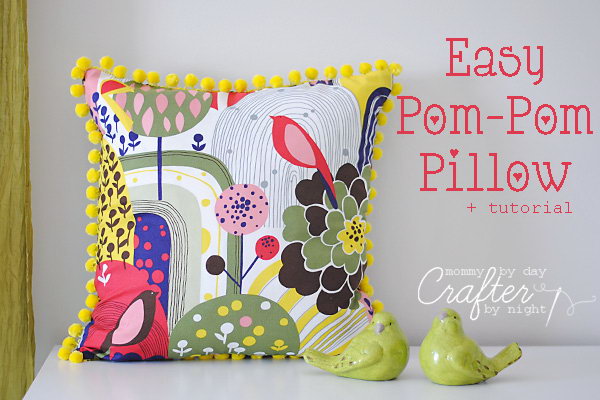 Easy Pom-Pom Pillow: The fabric is so vibrant and the matching yellow pom poms around edge are a great touch. Learn how to do 