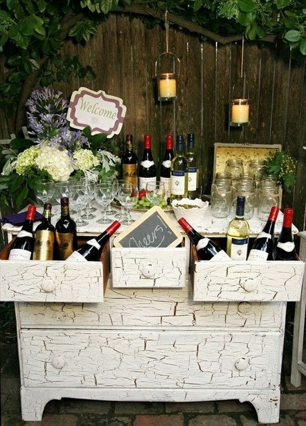 Wine Themed Drink Station. This wine themed drink station is perfect for your wedding celebration with bottles, a cheers sign and the well-displayed glassware. This creative beverage station will enable you to incorporate your personalities and passions into your reception decor.