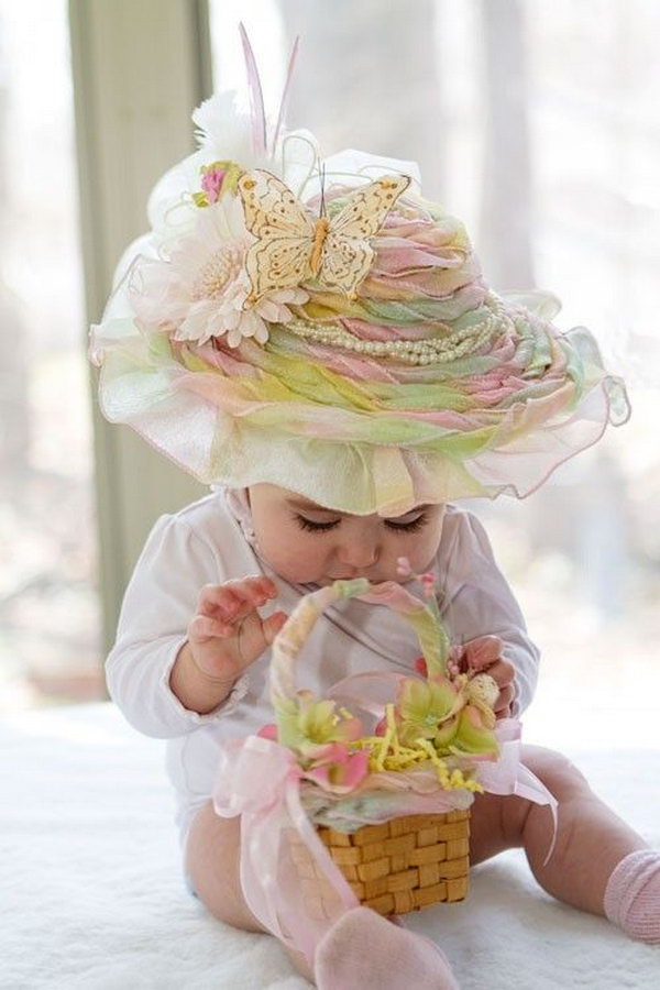 Rainbow Sherbet Frilly Easter Hat. This beautiful large frilly hat has a good combination of colors from the rainbow. With decorations of feathers, ribbon, beaded flower butterfly, it turns a little girl into the princess.