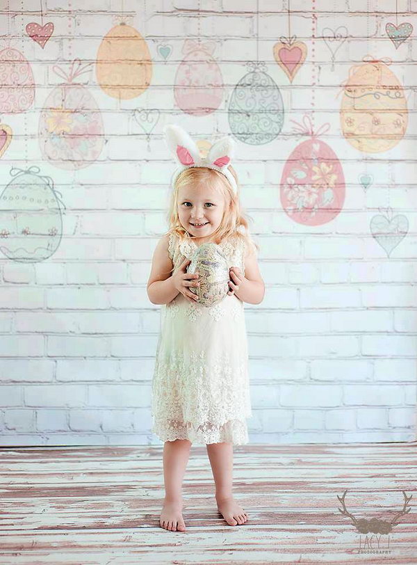 Hanging Easter Eggs on White Brick Backdrop. To catch a nice Easter photo, you need to select a nice scene to match with this festival and sets some mood for it. This white brick backdrop with hanging Easer eggs is a perfect choice.