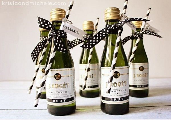 Mini Champagne Bottle Engagement Party Favors. Glue the tag on the straw and hang the confetti ring above the tag. Tie the straw to the Champagne bottle with the polka dot ribbons in a bow. They are so easy to make and perfect for your Engagement Party.
