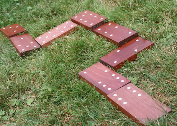 Dominoes. These life-sized dominoes made from wooden boards and stickers will provide fun for hours, and you've got a summer of fun.