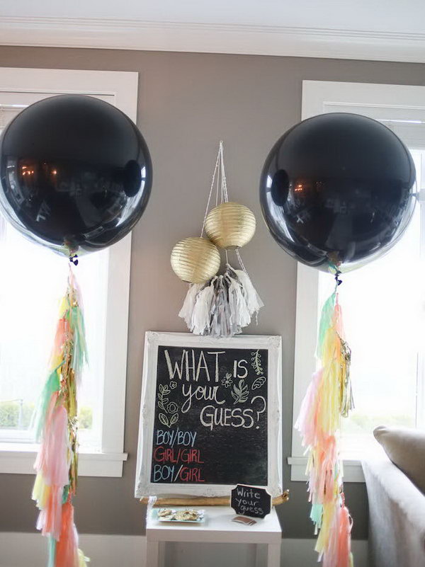 Boho Inspired Gender Reveal Party. Schedule this incredible gender reveal party with fabulous giant black balloons with tassel garland streamers, lovely floral crowns, boho inspired dessert table backdrop, star and heart shaped sugar cookies, the chalkboard signs. Every detail is just so fantastic.