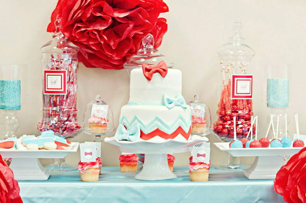 Bow Tie Gender Reveal Party. This adorable bow tie inspired gender reveal party is perfect for the little guy on his way to meet his parents with a good combination of welcome sign with the big read and polka dot bow ties on it, huge apothecary jars, adorable cookies, flower centerpieces, bow tie invitations.