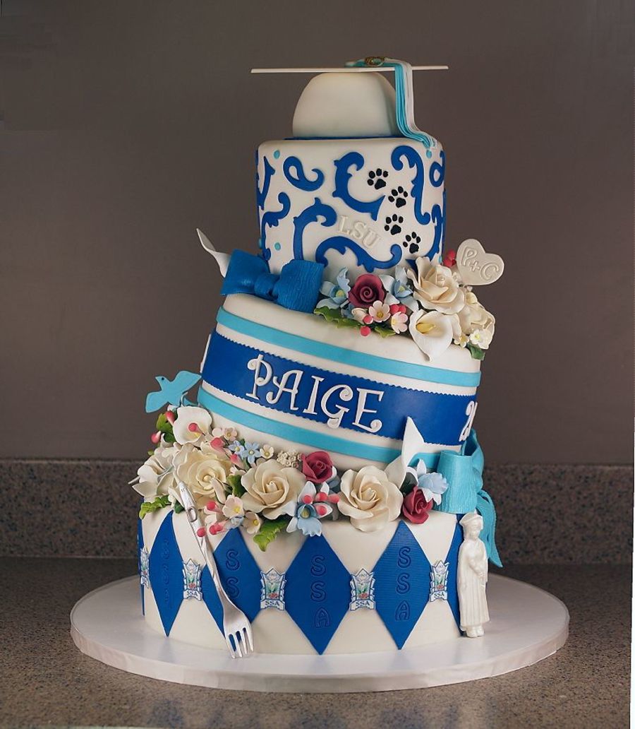 Graduation Tilted Cake. Unlike most graduation cake, this one is especially fun for its tilted outlook. The graduate must adore this gorgeous cake with stunning floral fondant decor, styro ball graduation cap, gumpaste fork as well as edible image logo.
