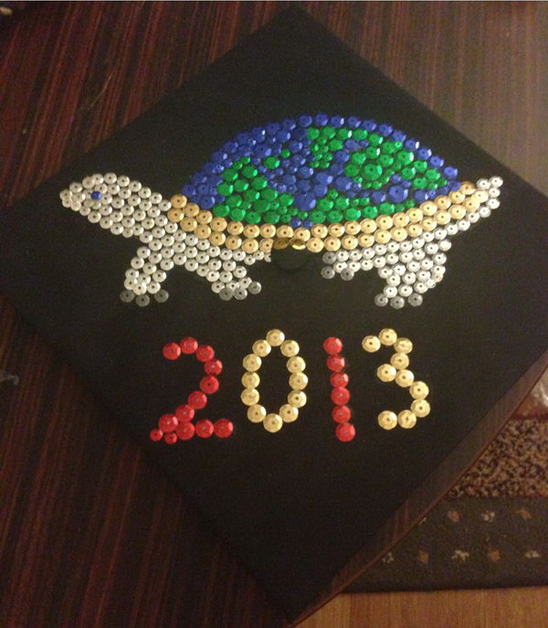 Turtle Carrying the Earth Graduation Cap. Decorate the graduate's cap with this turtle carrying the earth graduation cap with sparkling sequins to shine you through your bright future.