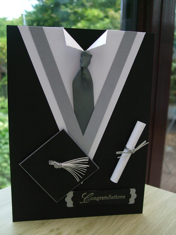 Graduation Gown Card. This graduation card is so attractive with its graduation gown design. Use black, silver and white cardstocks to create the gown shape. Use satin ribbon and elastic cords for the tassel and ties on the scroll for garnishment.