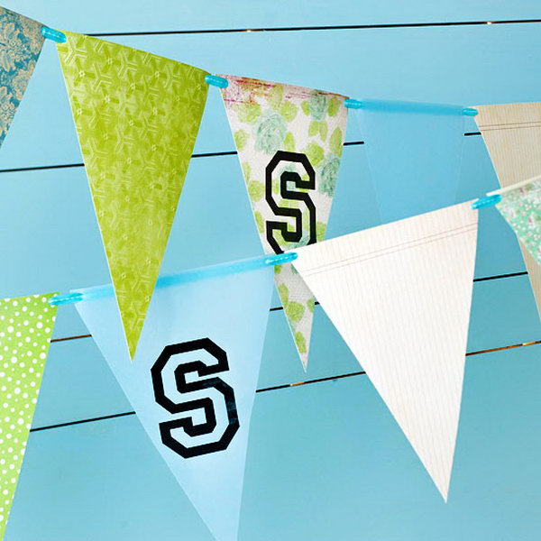 School Spirit  Garland Graduation Decor. Cut paper into triangles, mark up the sign of your school thread them through to create this graduation pennant garland to reflect the spirit of your school and ornament your graduation party.