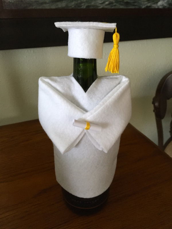 Funny Graduation Decoration. This graduation cap and gown champagne or wine bottle cover is just so fantastic with its funny outlook. It will definitely make the focal point of this graduation party.