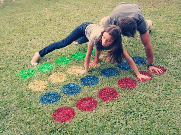 Outdoor Twister Graduation Party Idea. This game is the perfect addition to your graduation party for outdoor get-together by using only 4 cans of colorful spray paint and 5 sheets of poster paper.