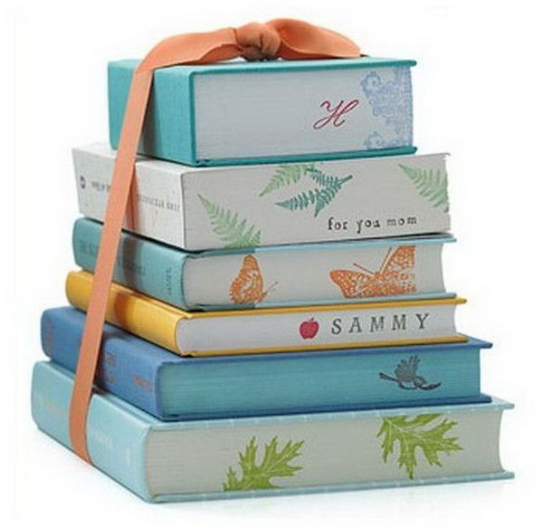 Graduation Party Centerpiece. Design the stacked books with cool, modern gift wrap in colorful prints to coordinate with the theme of you graduation party. You can even decorate the sides with the guest of honor’s names.