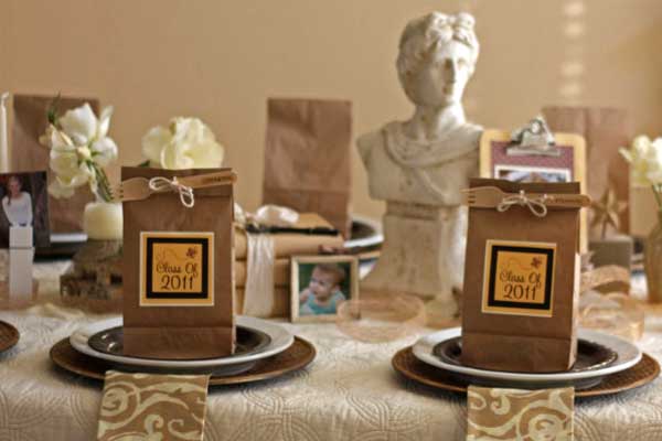 Through the Years Graduation Party. Use natural burlap ribbon wrapped around vases and a scholarly-looking bust for the centerpiece decoration. I really adore the neutral color scheme to give the party a casual and reminiscent of school flavor.