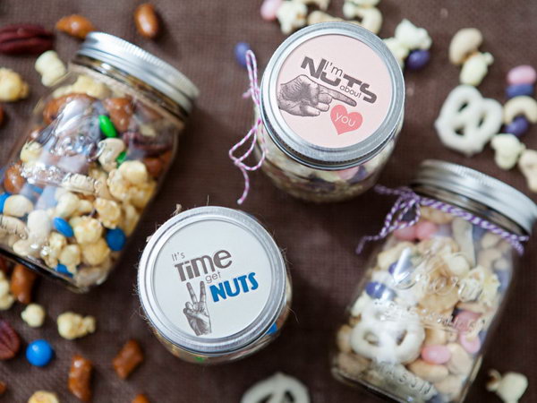 Mason Jar Trail Mix Graduation Party Favors. Customize the mason jars with trail mix package inside depending on the types of guests for a tasty flavor.