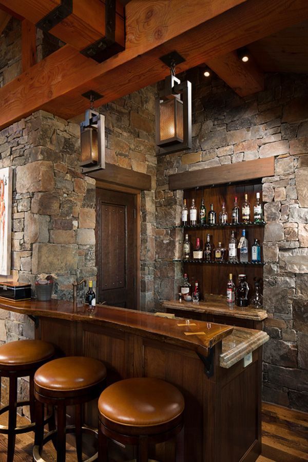 Rustic home bar design. The home bar has become one of the typical rooms in homes today. Rich wood, leather chairs,stone wall are popular in the modern-day life.