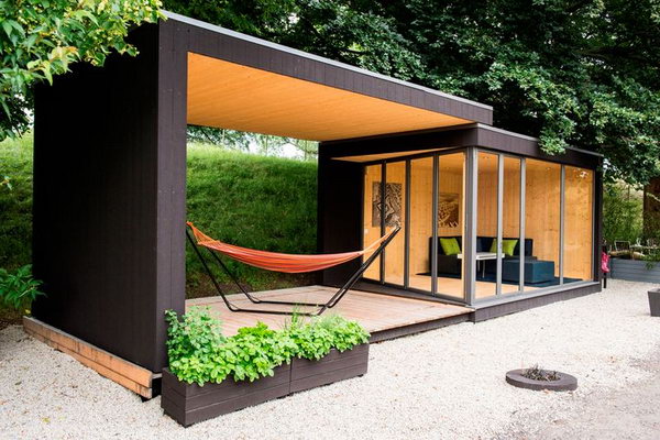 Backyard room. A new prefab house takes your outdoor backyard space and turns it into an office or guest cottage with a movable roof.