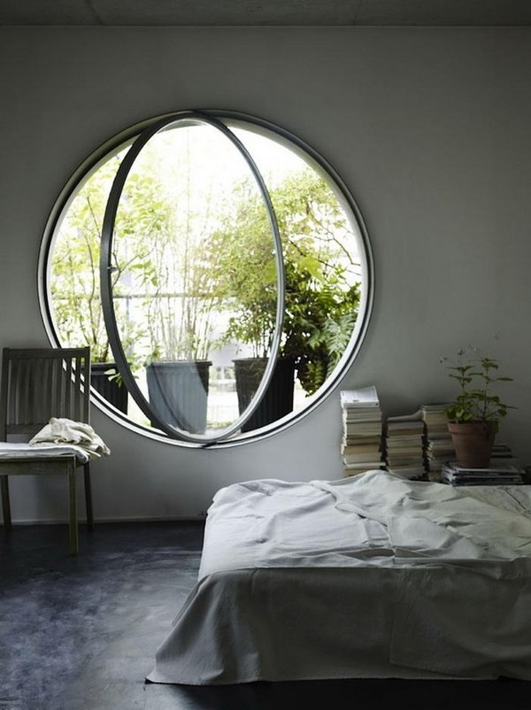 Huge round bedroom window. A huge round window in your bedroom make your sunbath dream come true. And the beautiful scene out of the window keep you in a good mood. 