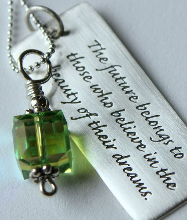 Sterling Silver Graduation Quote Pendant. This pendant features a green cube Swarovski crystal with a silver bali top and a pretty rectangle with the inspirational quote, the future belongs to those who believe in the beauty of their dreams by Eleanor Roosevelt will definitely inspire the graduate to go after his or her dream bravely.