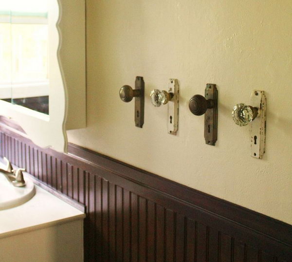 Use doorknobs to hang towels. Recycle your old doorknobs and install them on the wall for hanging towels or clothes.