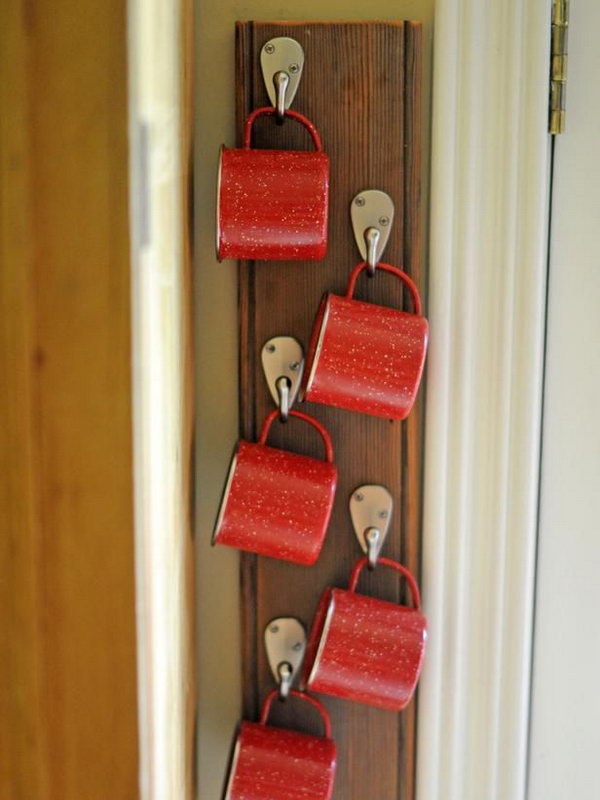 Personal hooks made from a coat rack. To encourage your kids to drink more water, install a coat rack on the wall, and everyone will have their own hook based on their height. 