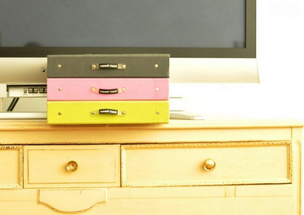 Useful Boxes to Keep Things Organized. Invest affordable storage containers to avoid the mess caused by DVDs, CDs and paperwork for electronics. A simple storage container can turn your room decor into a tidy and clean style.