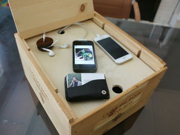 Wine Crate Charging Station. Use a favorite container such as wine crate to create a storage unit to keep all you gadgets organized and conceal them in a neat space.