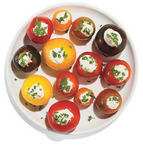 Horseradish-Stuffed Cherry Tomatoes. Use small knife to scoop out centers of cherry tomatoes, spike mayonnaise with horseradish. Top it with fresh herbs to present a beautiful outlook. It's super chic to serve your guests with this dinner party food. 
