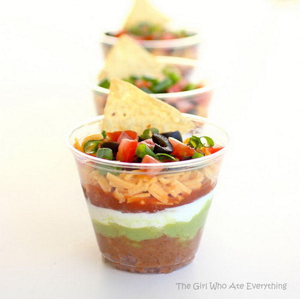 Individual seven layer dips. You may wonder how to create these colorful seven layers. This appetizer combines beans and taco seasoning, sour cream, guacamole, salsa or pico de gallo, cheese, tomatoes and green onion. It's perfect for a normal party or get together. 